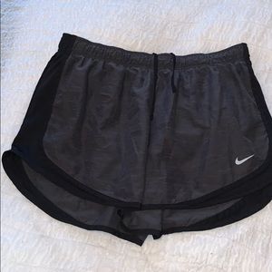 Grey and black Nike running shorts